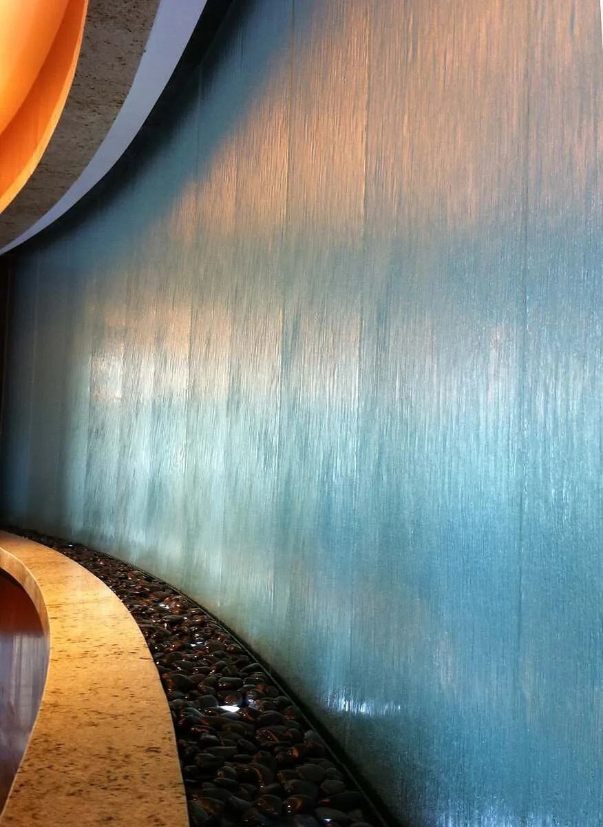 Embassy suites houston curved glass water wall clo